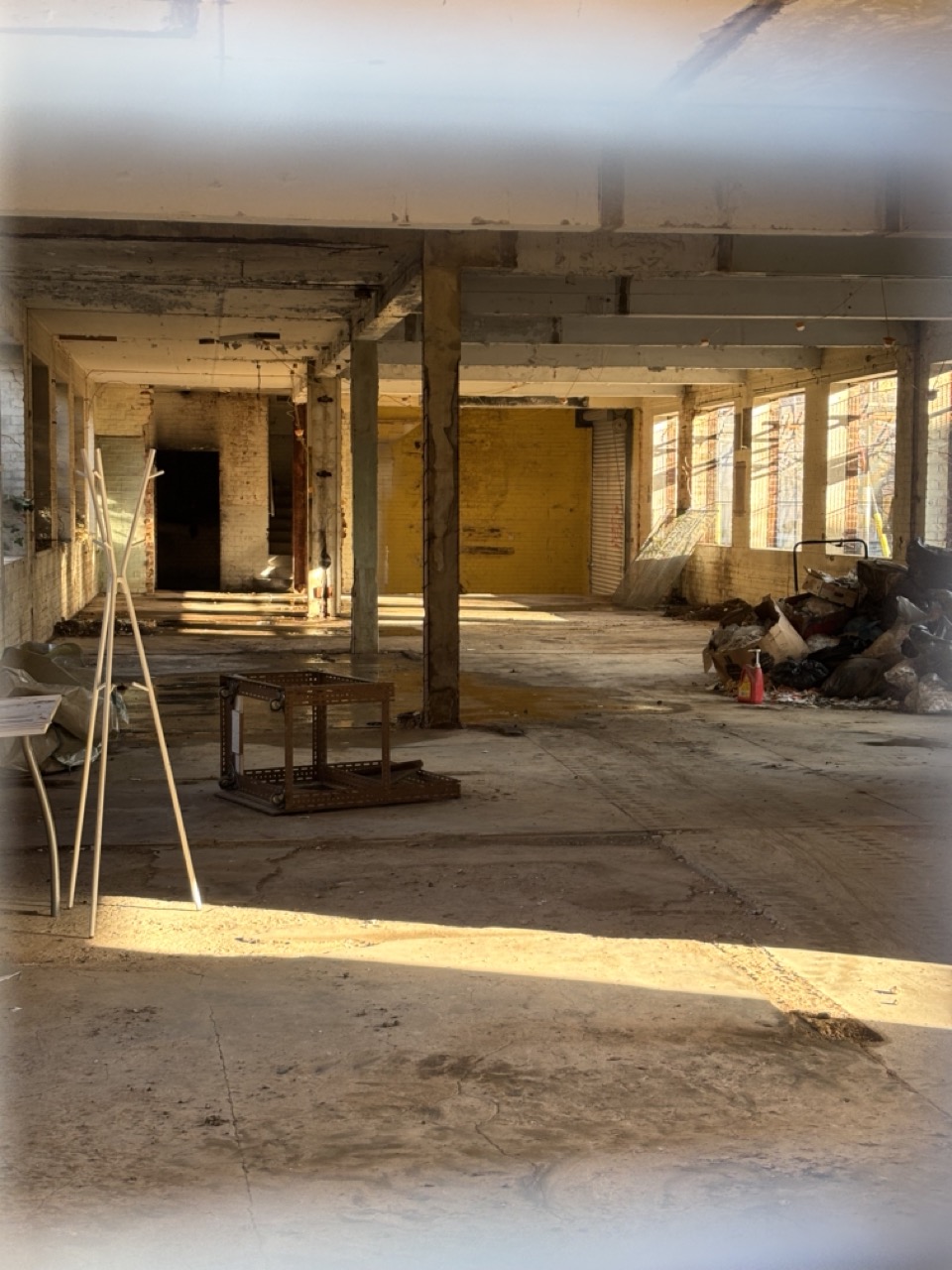 Photograph of interior of a previously abandoned commercial unit in London, in the process of clearing for redevelopment